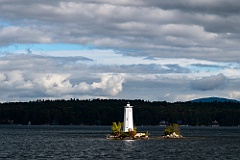 Sunlight Breaks Through Clouds and Illuminates Loon Island Light